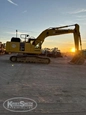 Front of used Excavator,Used Excavator,Side of used Komatsu Excavator,Back of used Excavator,Used Komatsu Excavator,Side of used Excavator under setting sun